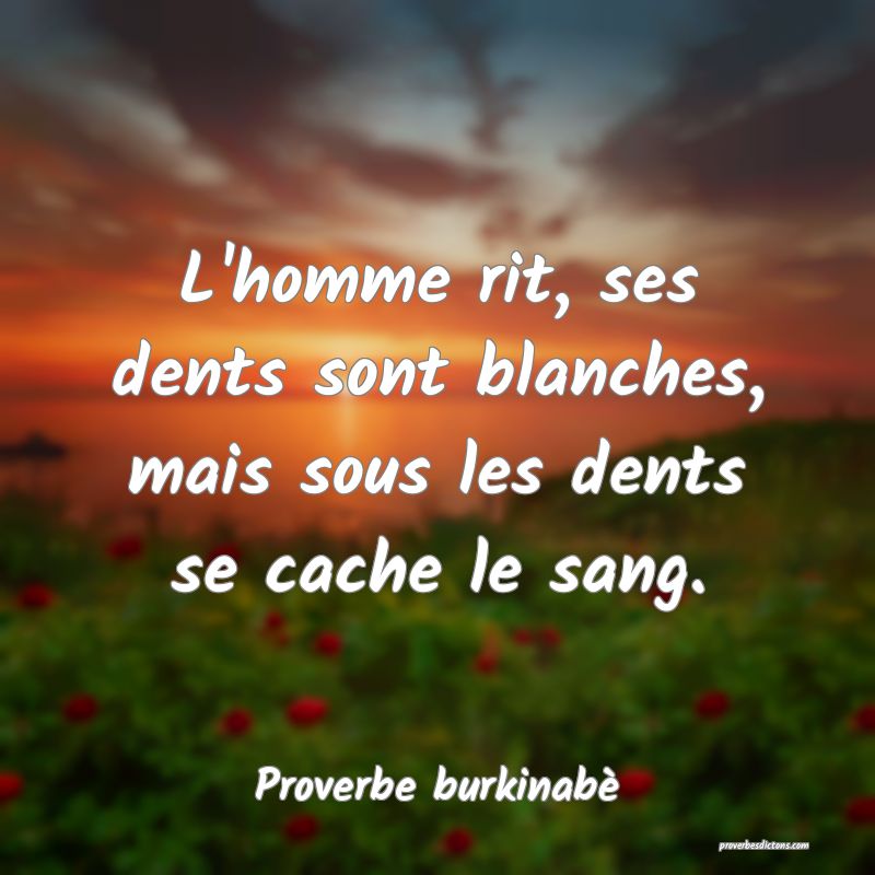 L'homme rit, ses dents sont blanches, mais sous les dents se cache le sang.